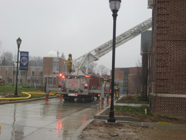 Ladder 21 operating at a building fire in Lincoln University.